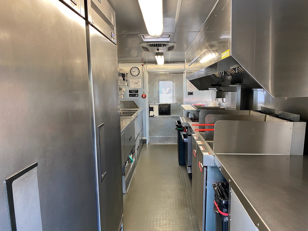 Large hood and cooking area Kitchen Area with fridges