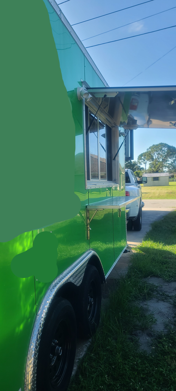 Food Trailer For Sale Sebring FL – Driveway Exterior View Green Food Trailer For Sale Parked in Driveway in Sebring FL