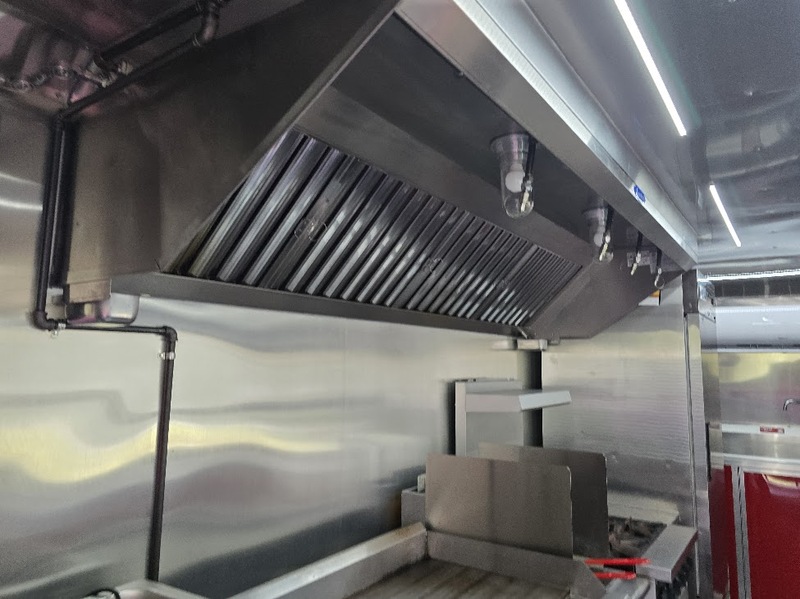 Exhaust hood and covered porch combination, a rare feature on this BBQ trailer for sale