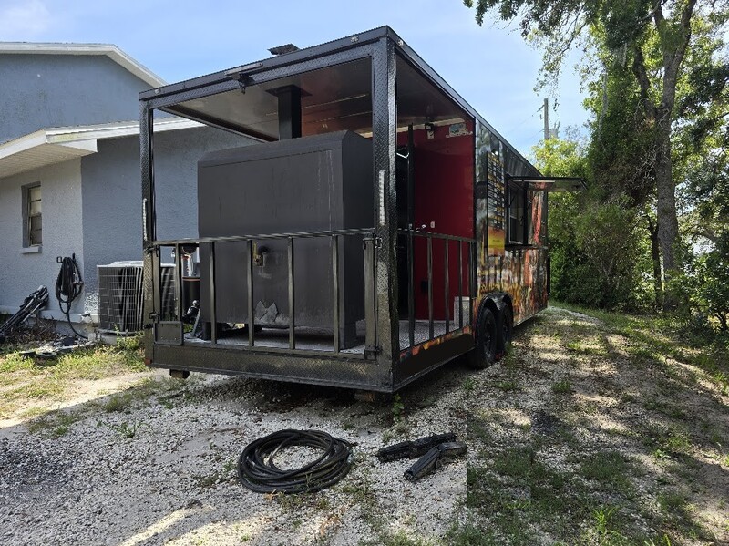 Close-up of BBQ smoker mounted on food trailer for sale in Florida